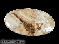 Кабошон барита. Погрешность измерения в пределах 0,5 - 2 мм. Мелкие выемки.