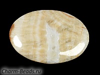 Кабошон барита. Погрешность измерения в пределах 0,5 - 2 мм. Мелкие выемки.